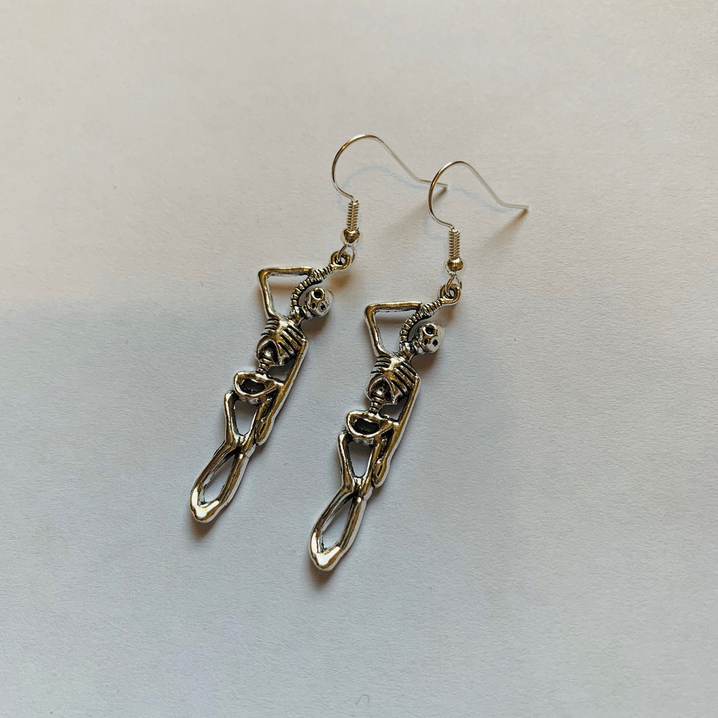 Silver hanging skeleton halloween earrings