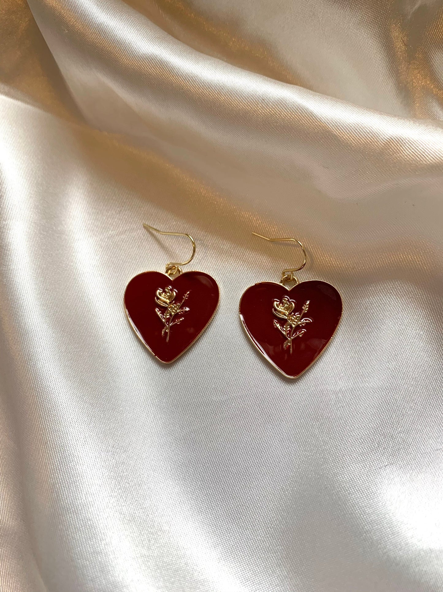 Dark red heart with gold rose dangle earrings.