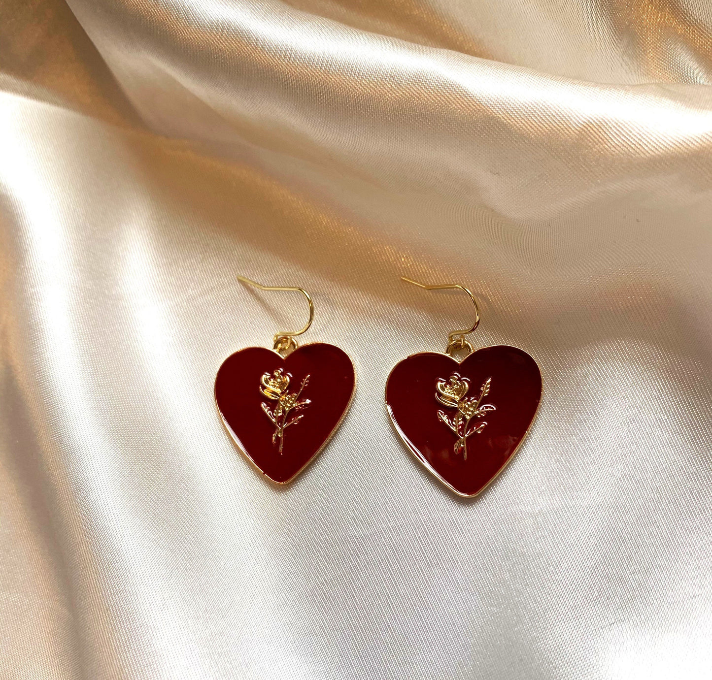 Dark red heart with gold rose dangle earrings.