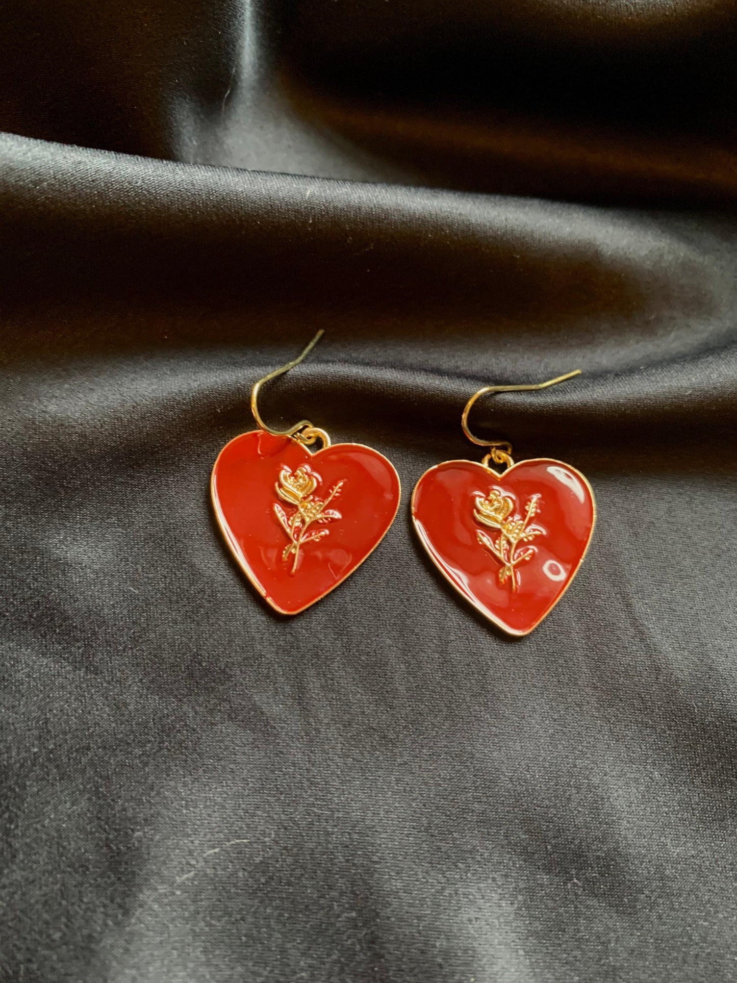 Dark red heart with gold rose dangle earrings.