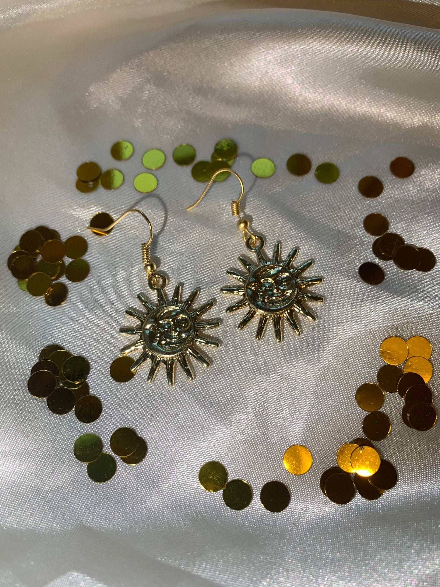 Gold sun and moon face celestial dangle earrings