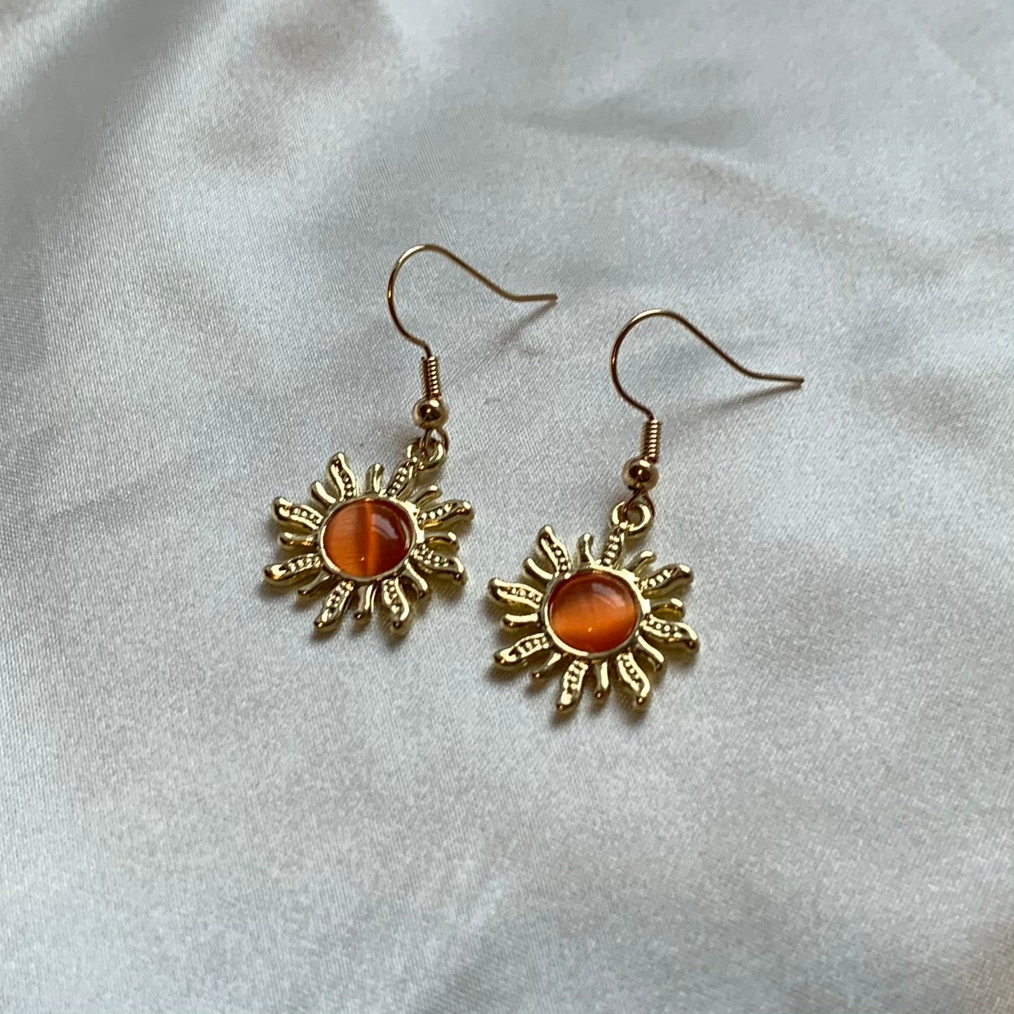 Gold orange sun earrings with orange centre dangle earrings