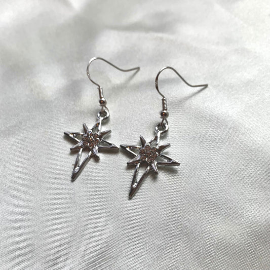 Silver north start diamante dangle earrings