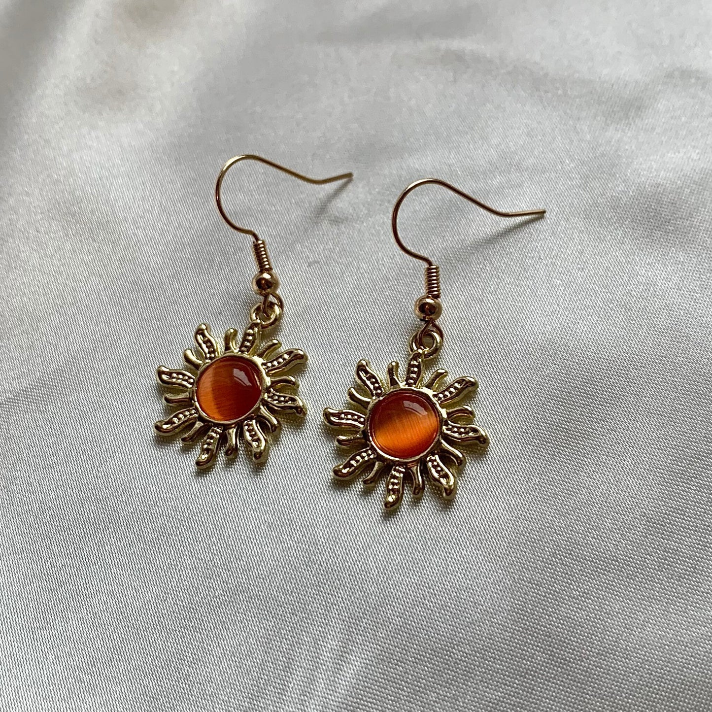 Gold orange sun earrings with orange centre dangle earrings