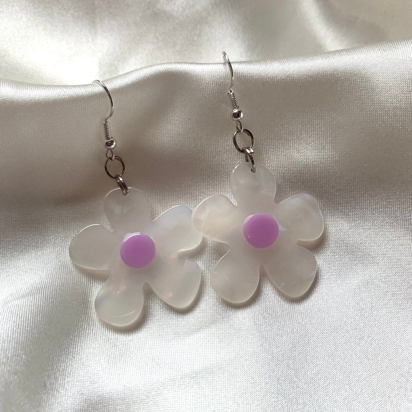 White and yellow or purple opaque flower earrings