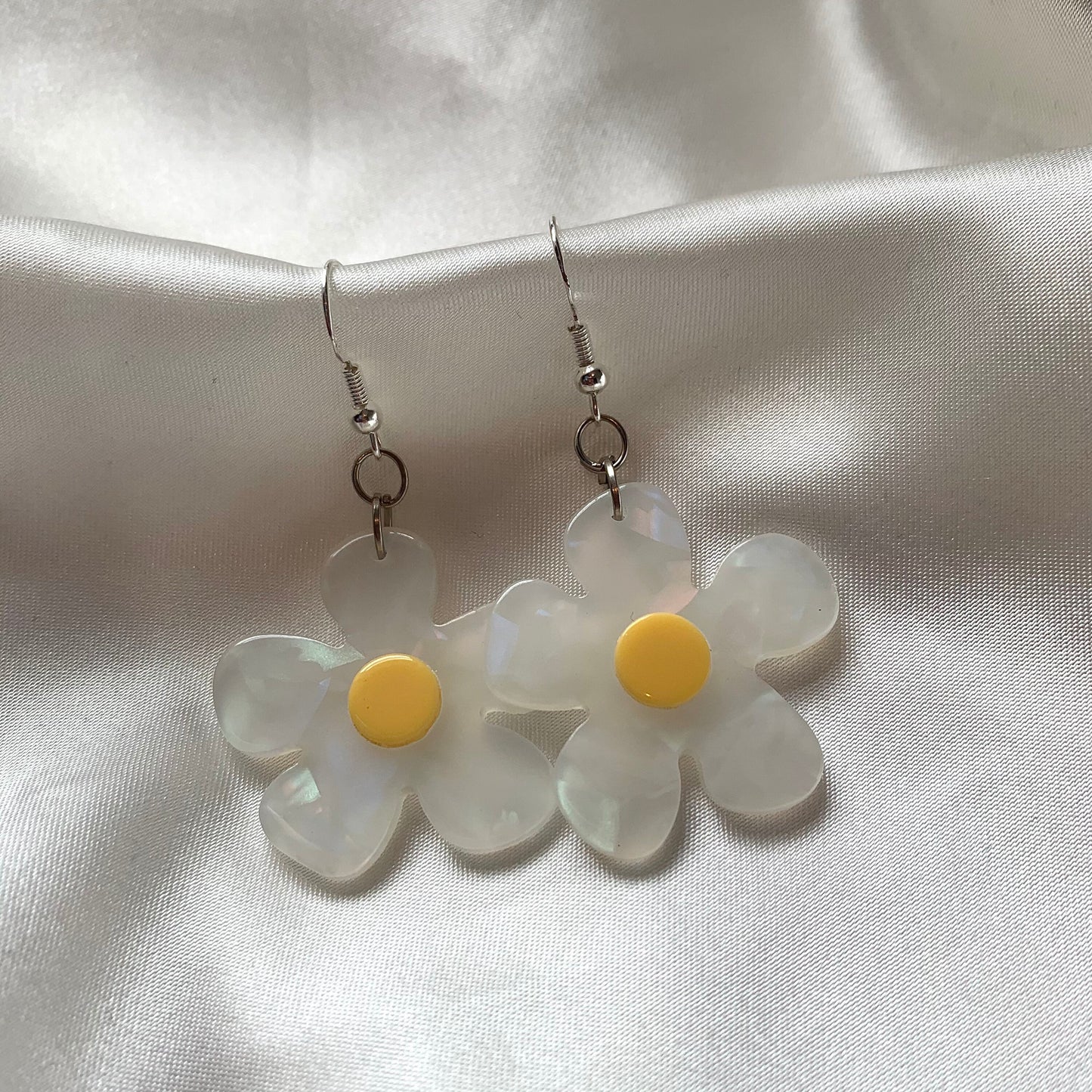 White and yellow or purple opaque flower earrings