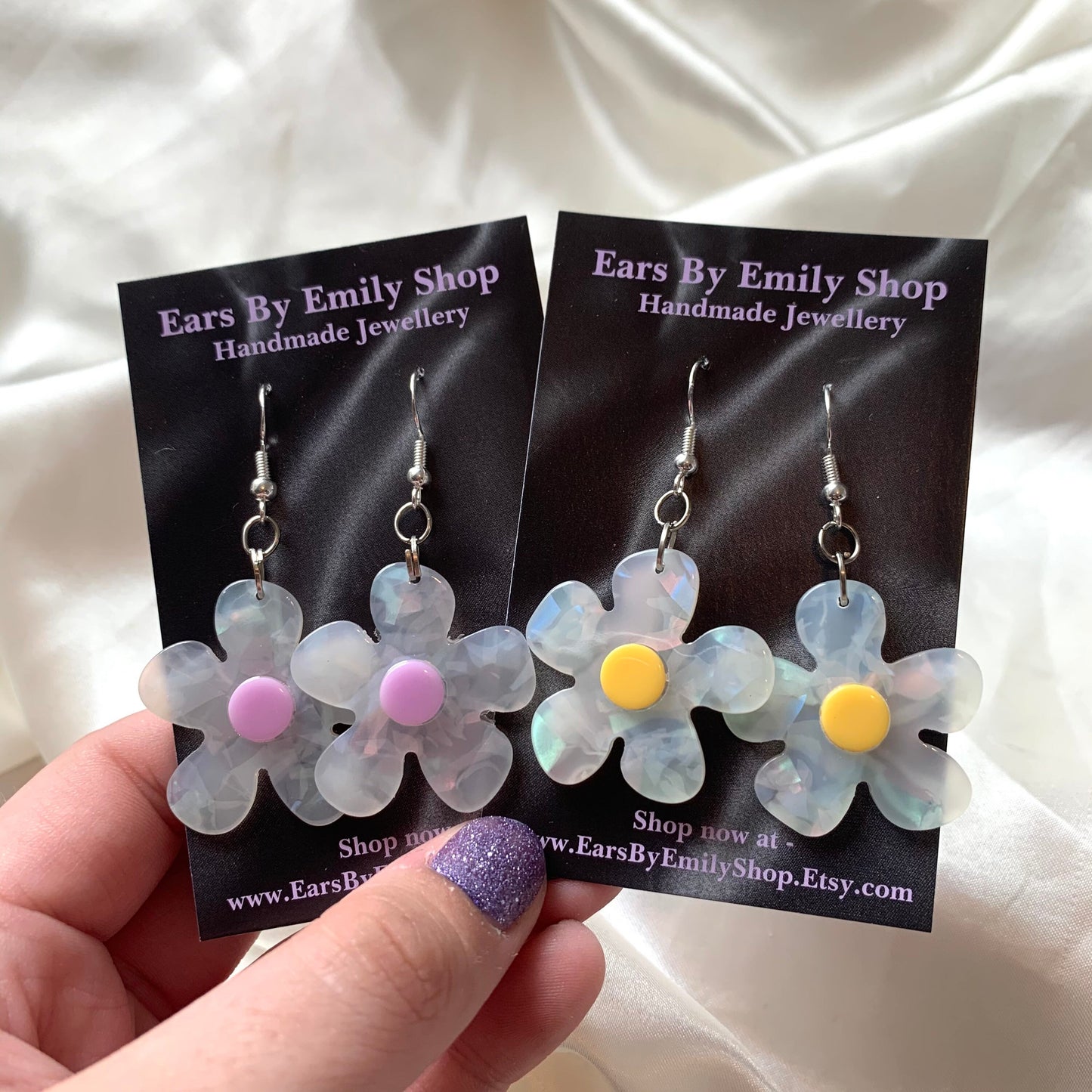 White and yellow or purple opaque flower earrings