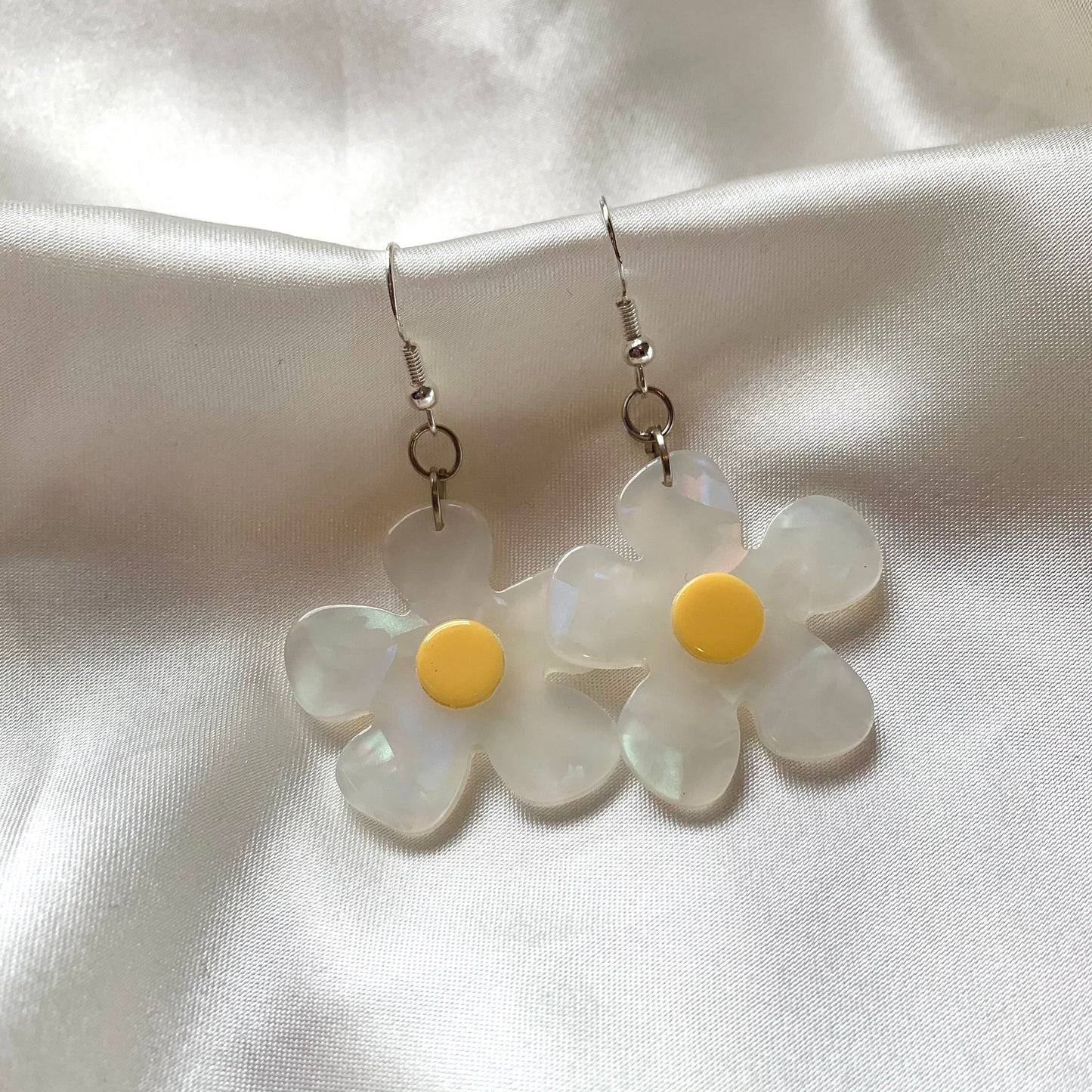 White and yellow or purple opaque flower earrings