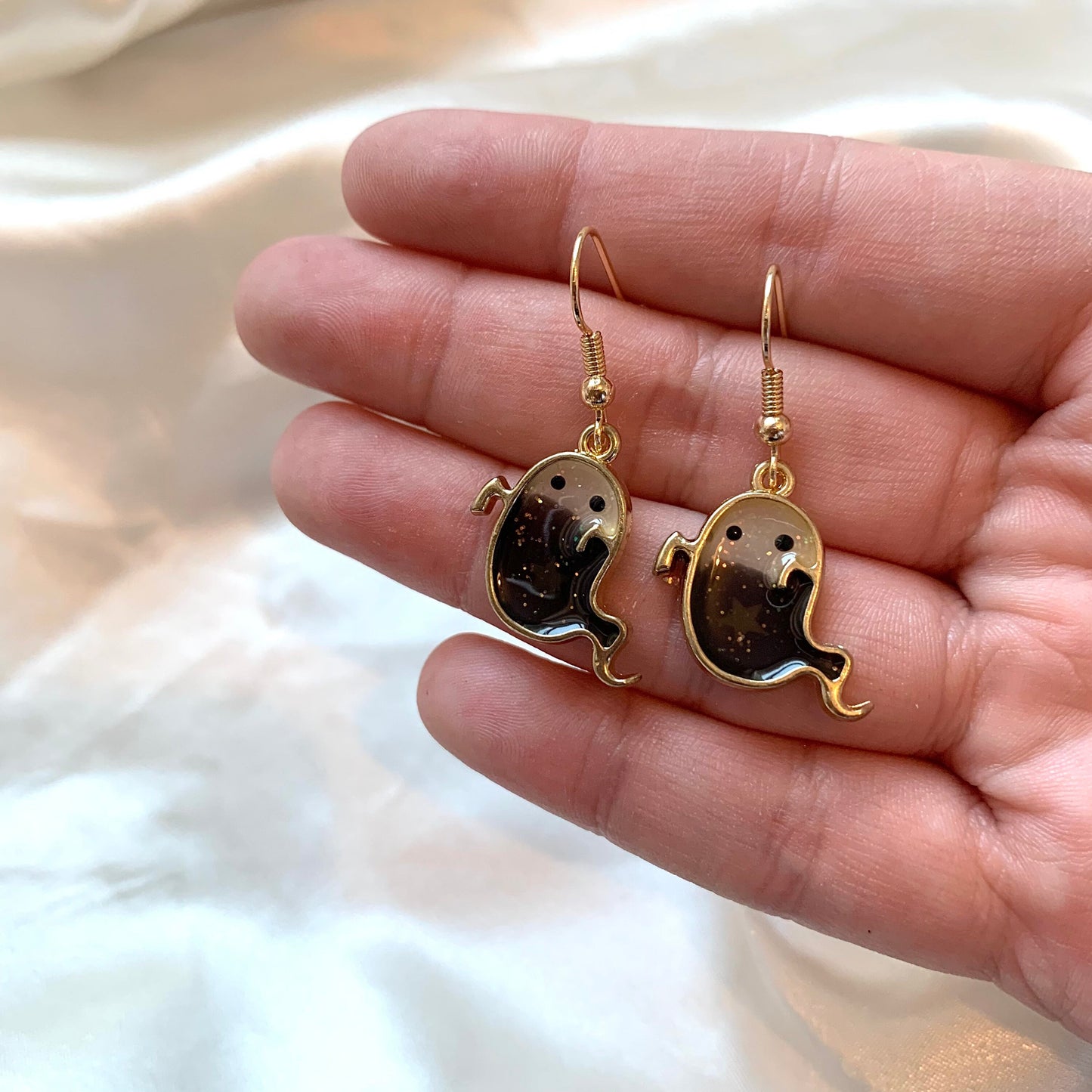 Black resin ghost dangle gold earrings