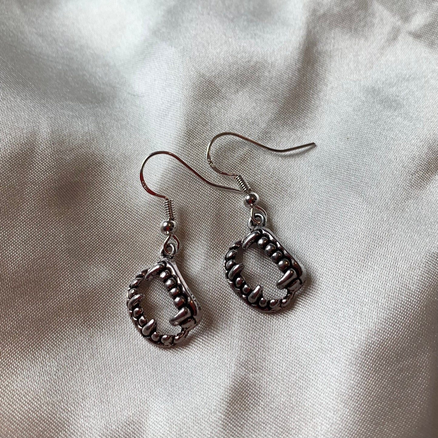 Silver halloween vampire fang earrings