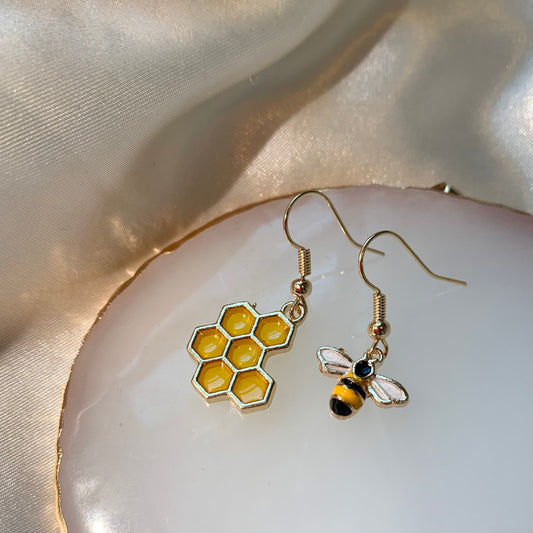 Yellow and black gold bee earrings with yellow honey comb