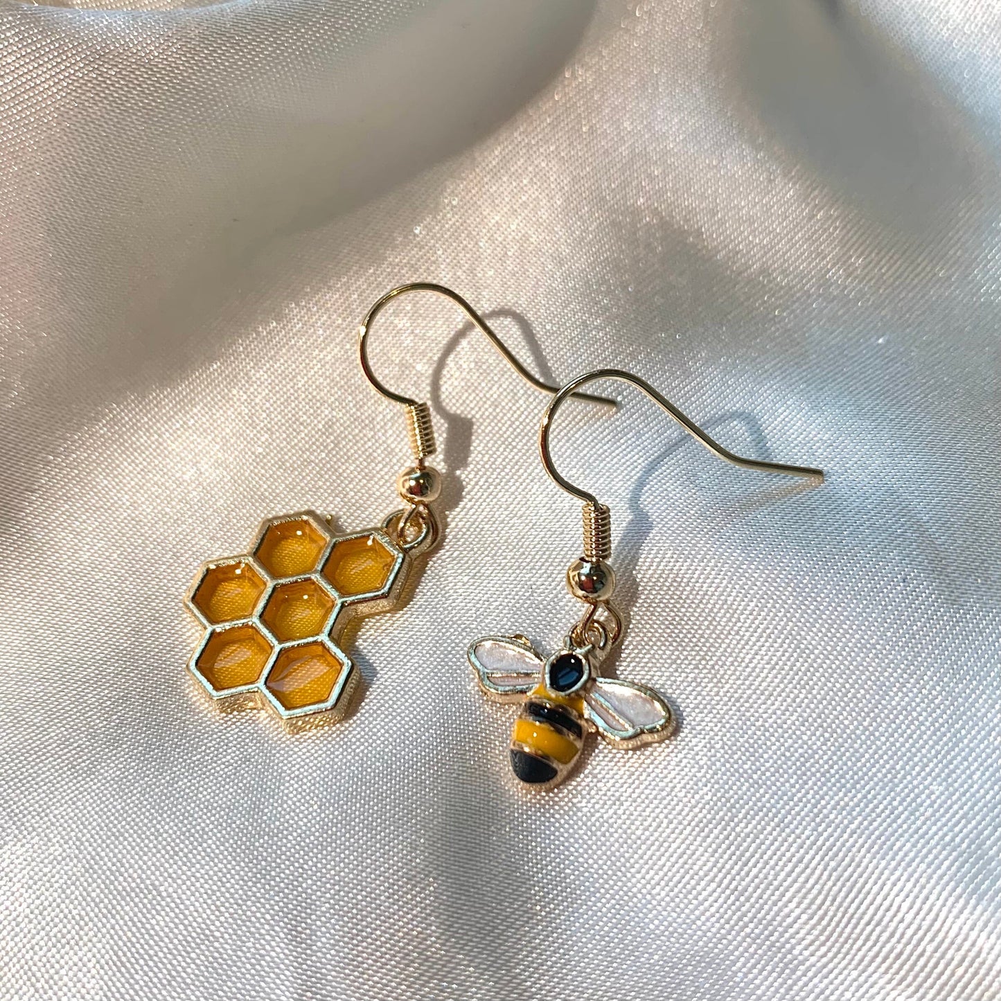 Yellow and black gold bee earrings with yellow honey comb