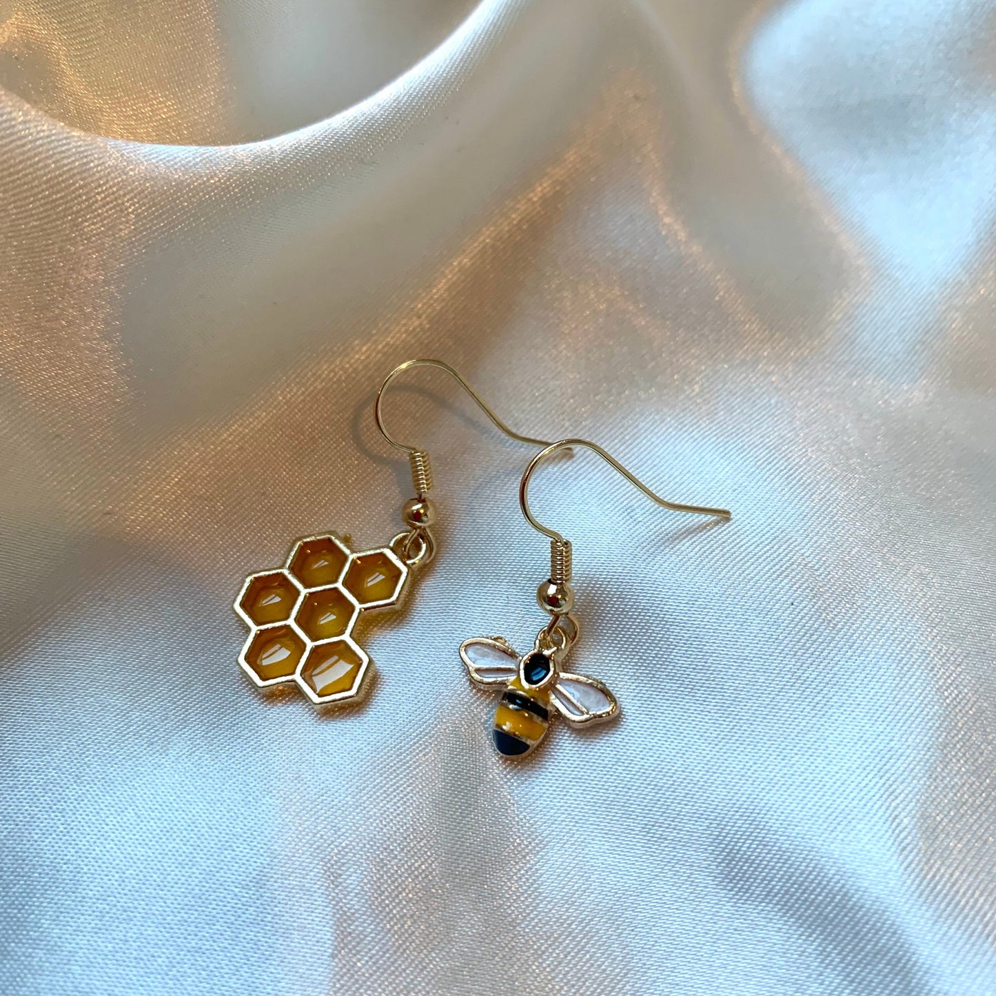 Yellow and black gold bee earrings with yellow honey comb