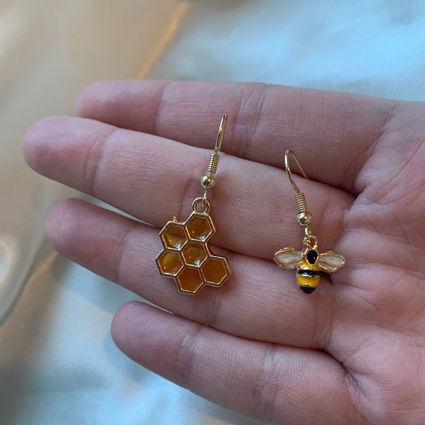 Yellow and black gold bee earrings with yellow honey comb