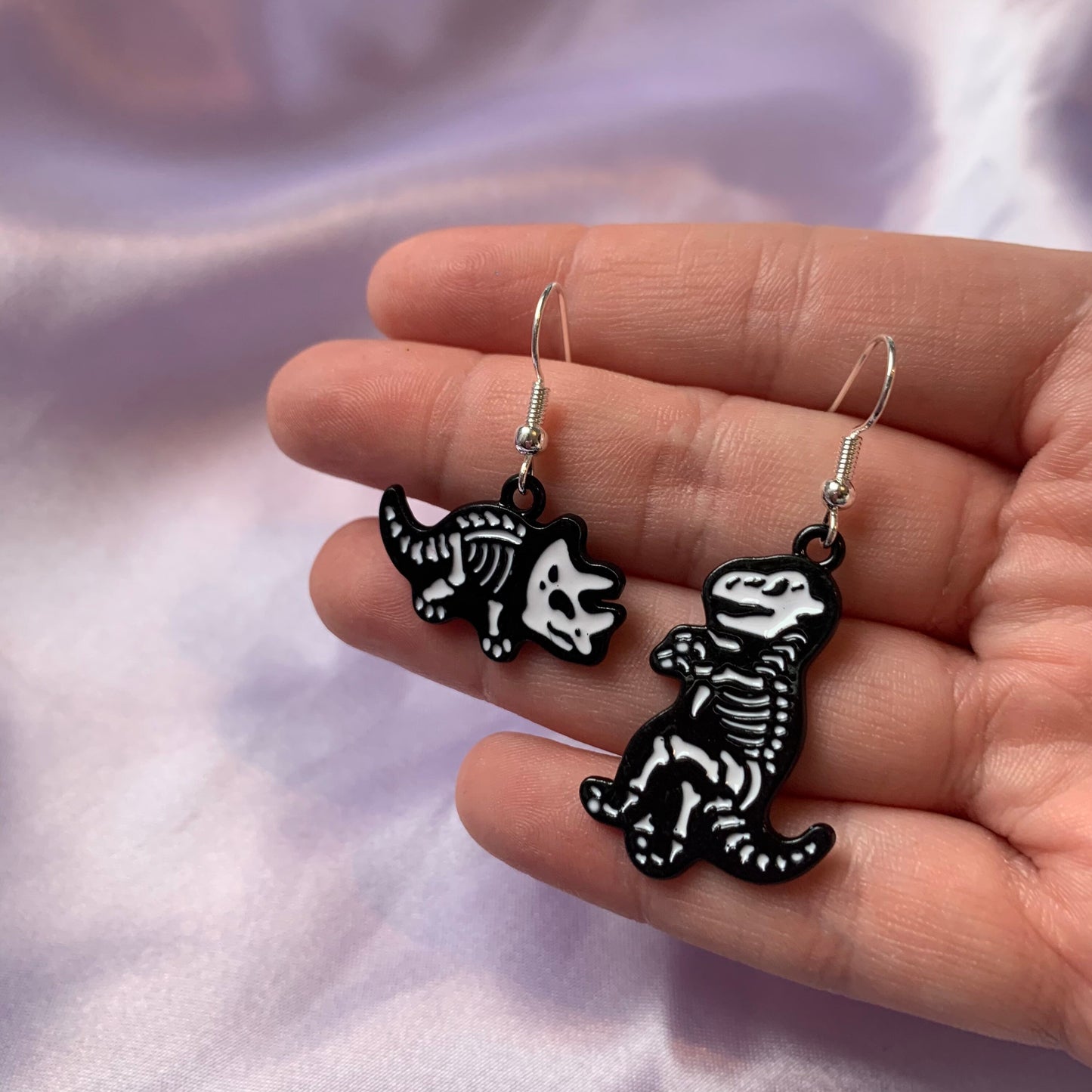 Dinosaur t-rex and triceratops black and white cartoon skeleton earrings