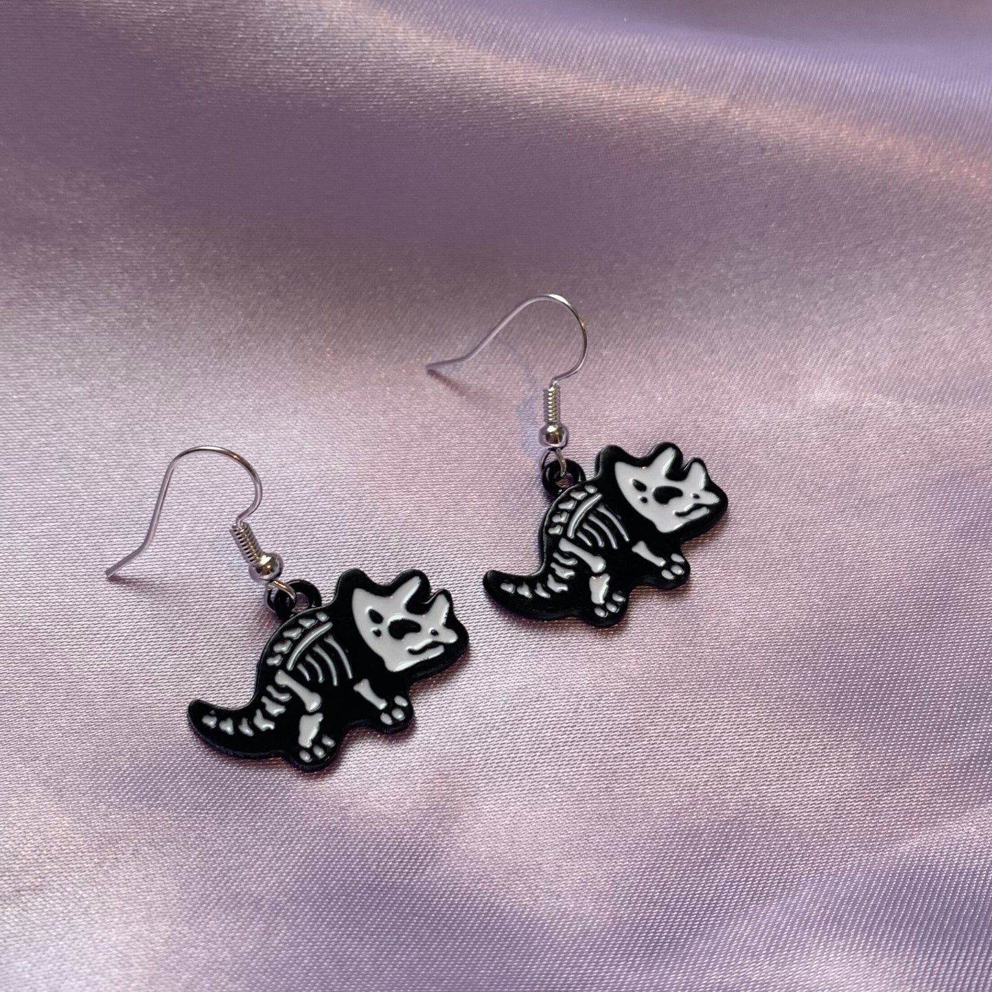 Dinosaur t-rex and triceratops black and white cartoon skeleton earrings