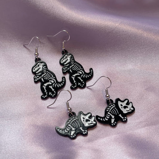 Dinosaur t-rex and triceratops black and white cartoon skeleton earrings