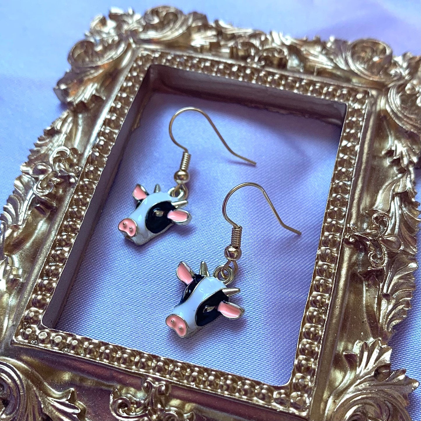 Black and white enamel cow gold earrings