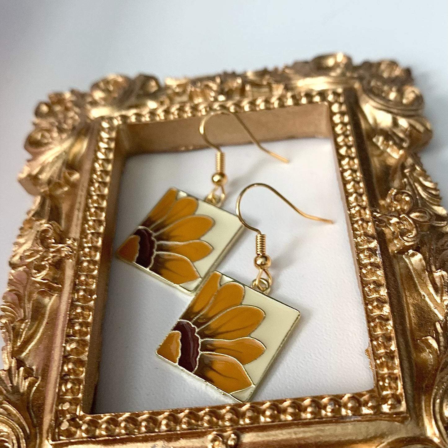 Yellow sun flower gold earrings in square frame