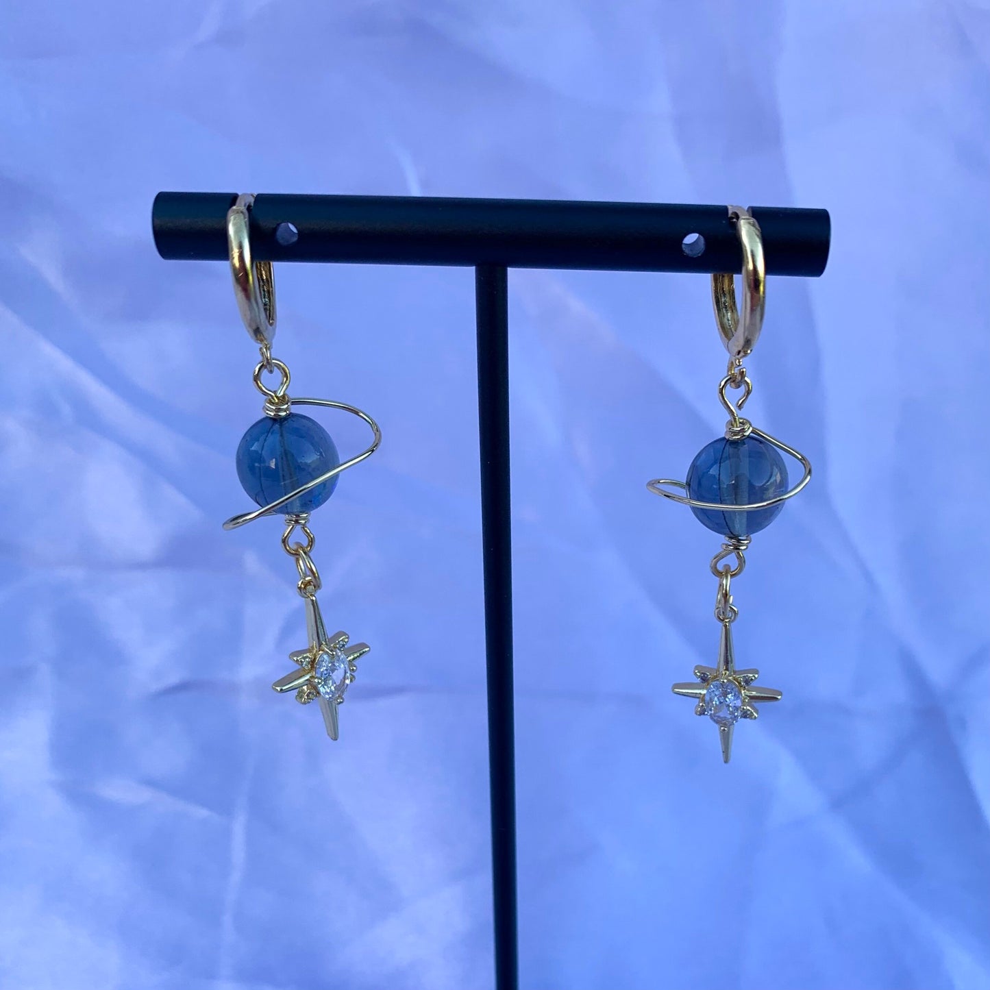 Gold plated celestial Saturn planet dangle hoop earrings with diamanté star