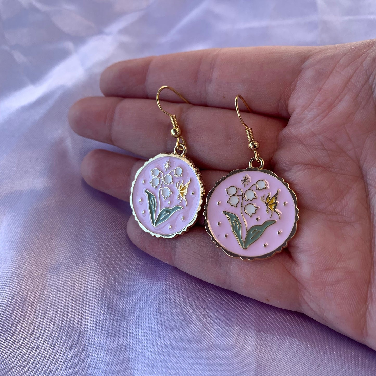 Pink circle with flowers and butterfly dangle gold earrings