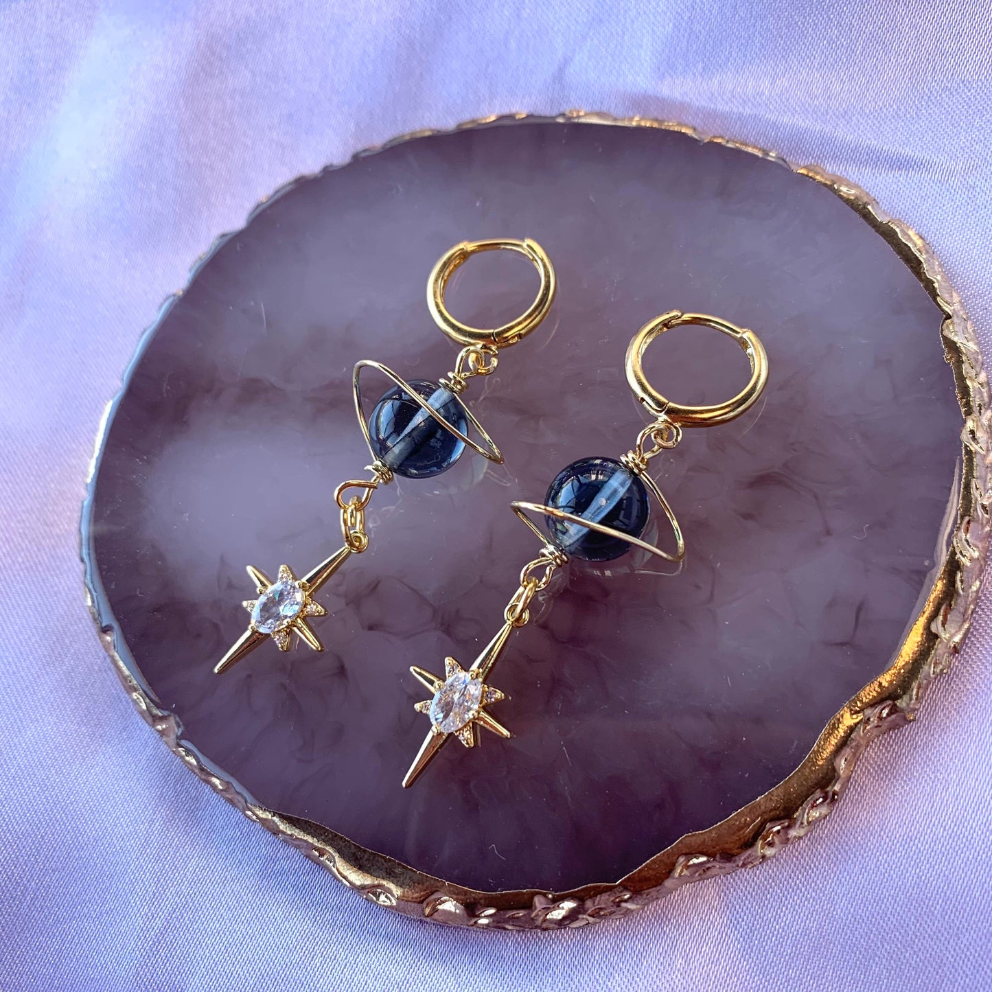 Gold plated celestial Saturn planet dangle hoop earrings with diamanté star