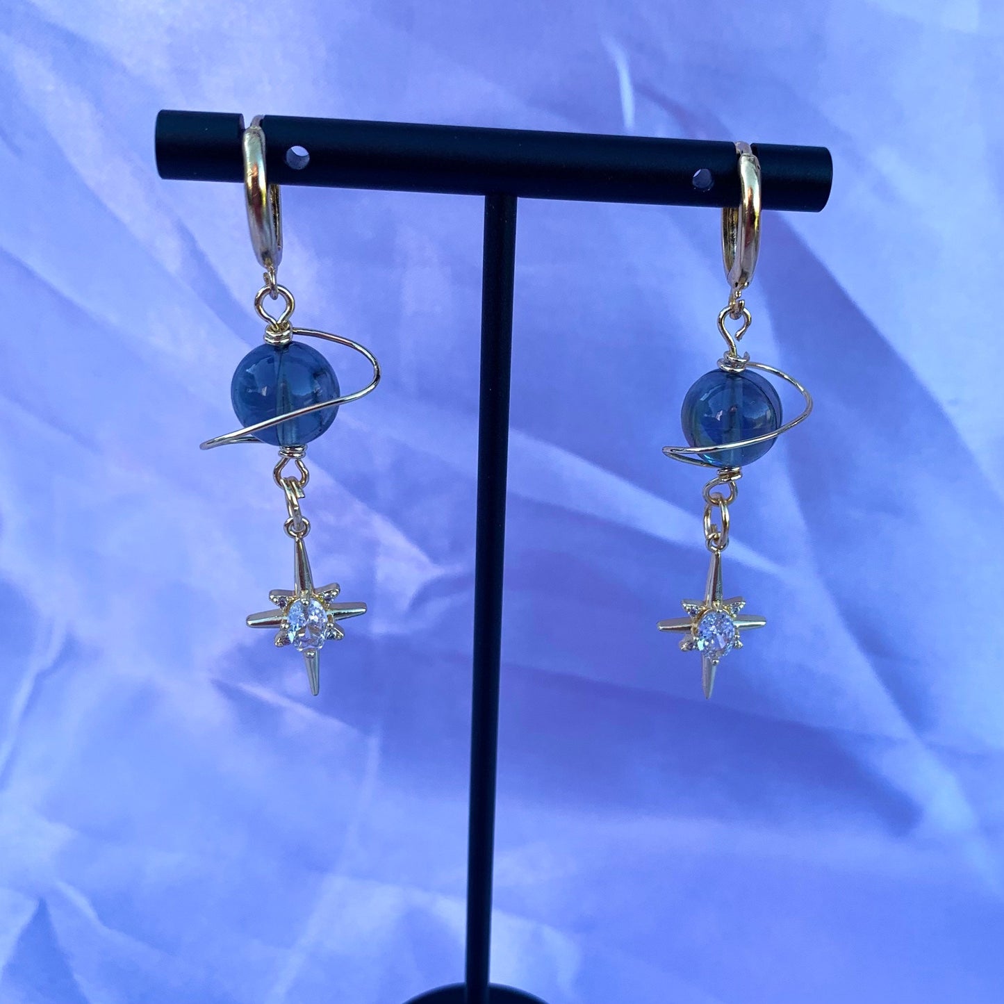 Gold plated celestial Saturn planet dangle hoop earrings with diamanté star