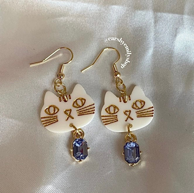 White and gold crystal cat gold dangle earrings