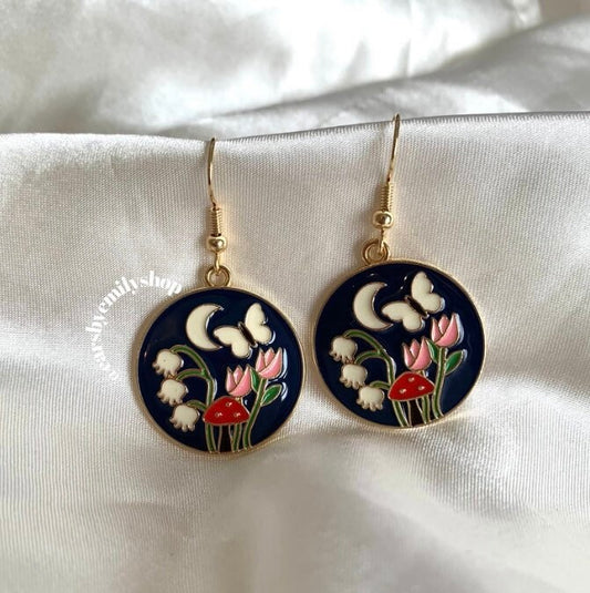 Navy blue circle with flowers and butterfly gold earrings