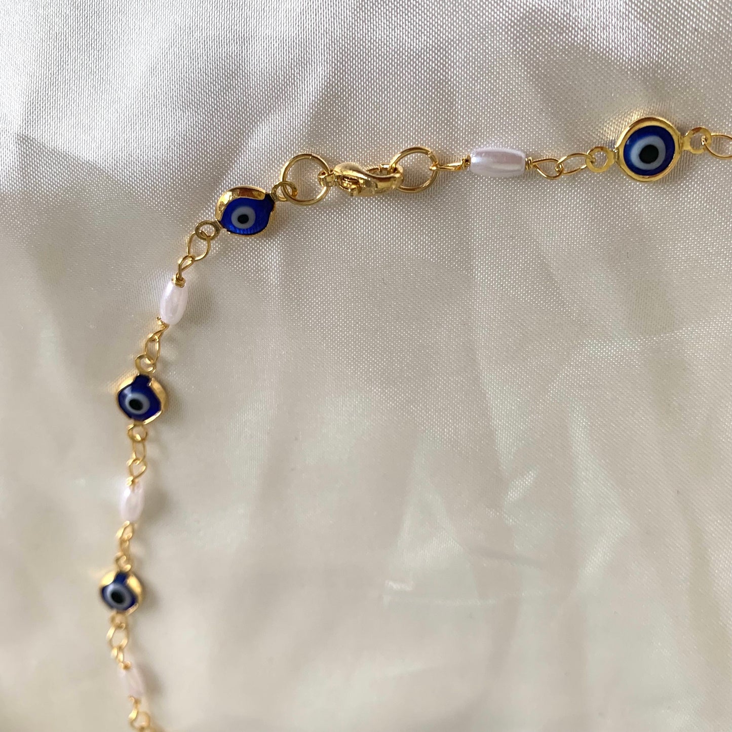 Gold plated blue evil eye and faux pearl quirky choker necklace