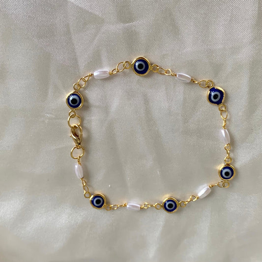 Gold plated blue evil eye and faux pearl bracelet