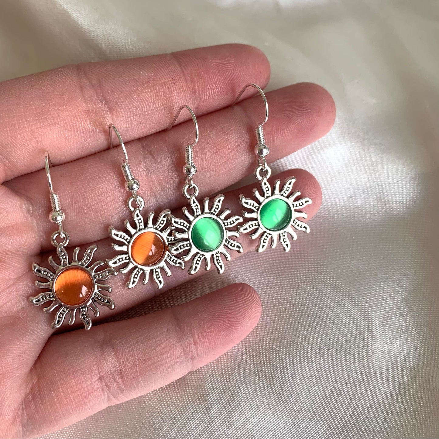 Silver orange or green centre feature sun drop dangle earrings