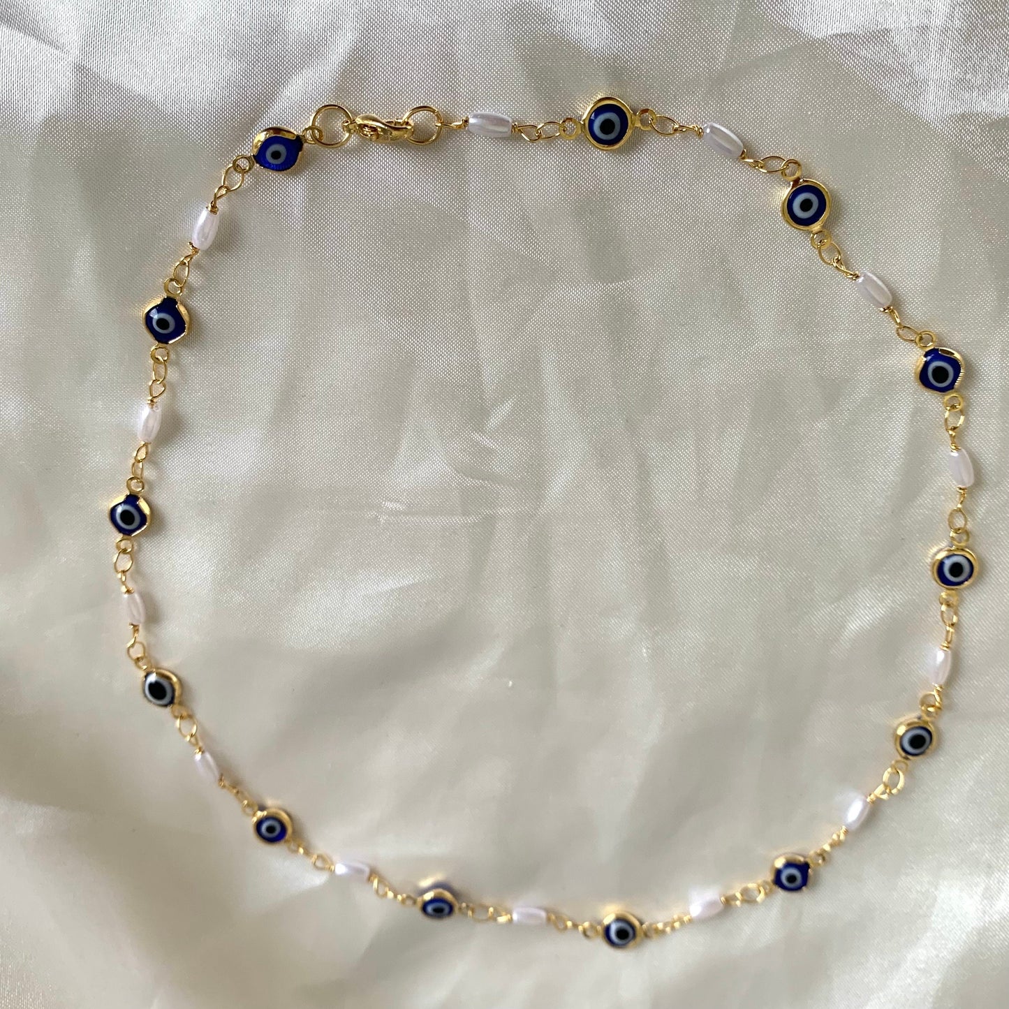 Gold plated blue evil eye and faux pearl quirky choker necklace