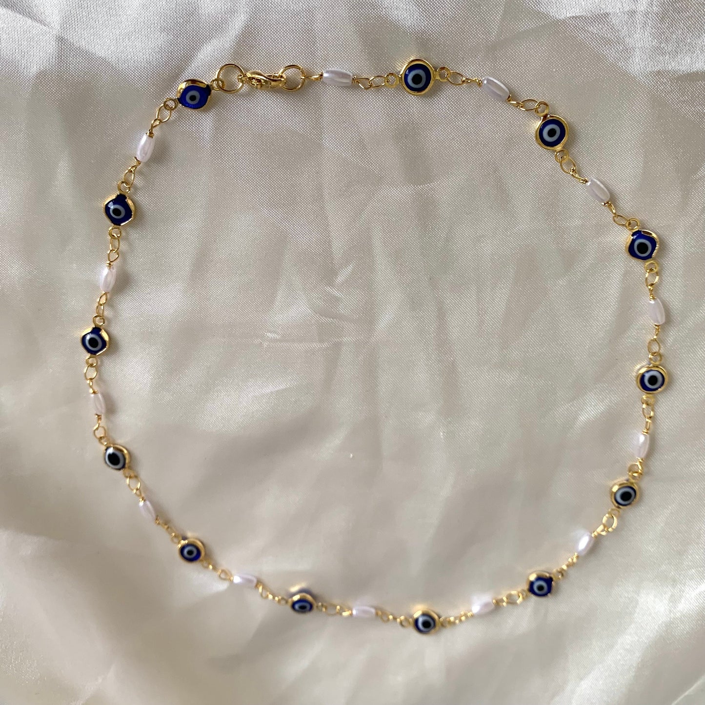 Gold plated blue evil eye and faux pearl quirky choker necklace