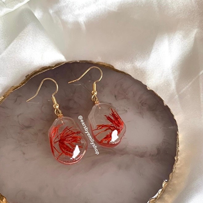 Red plant in abstract oval resin gold earrings