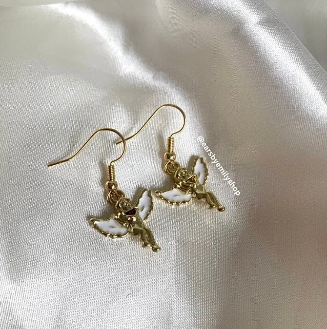 Gold and white angel cupid earrings