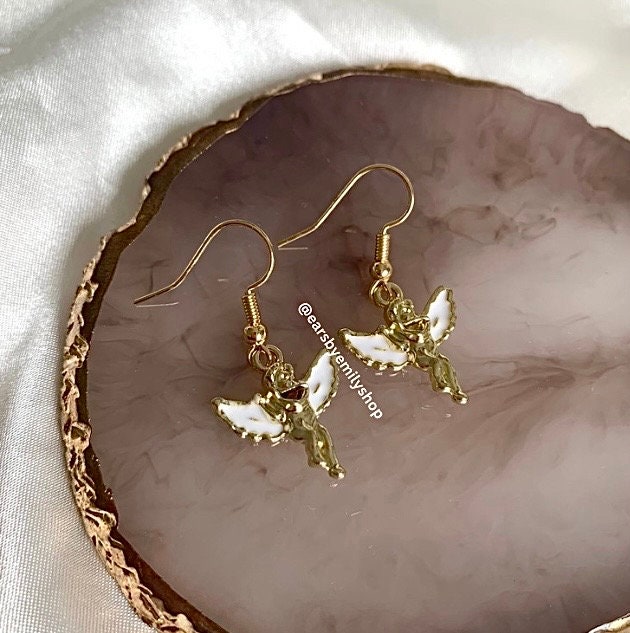 Gold and white angel cupid earrings