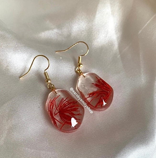 Red plant in abstract oval resin gold earrings