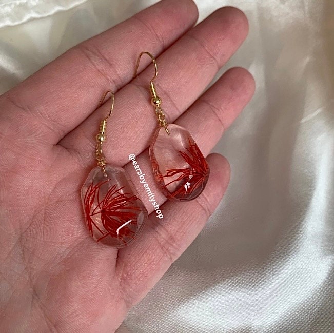 Red plant in abstract oval resin gold earrings