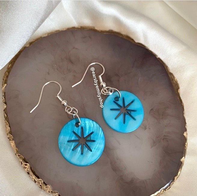 Cool quirky  beach inspired blue sea shell disc earrings with star cut out on silver plated hooks