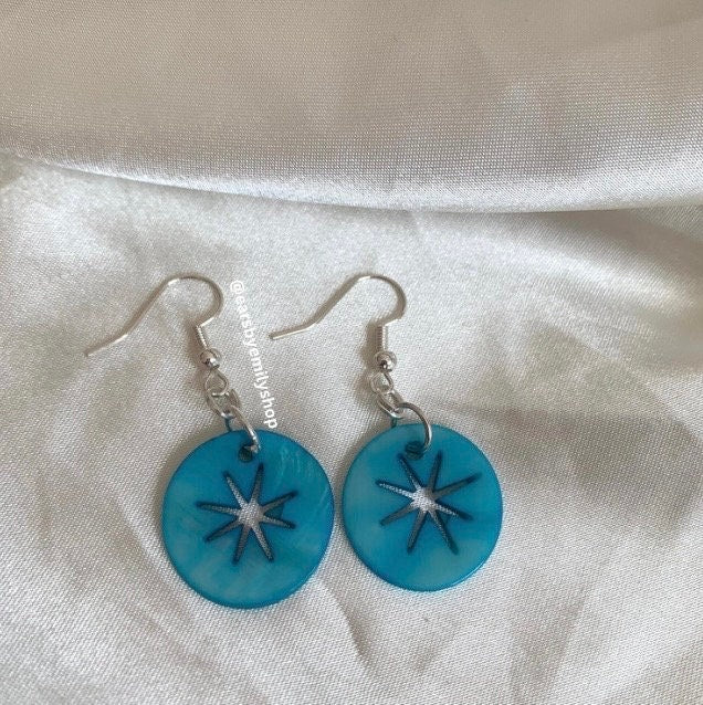 Cool quirky  beach inspired blue sea shell disc earrings with star cut out on silver plated hooks