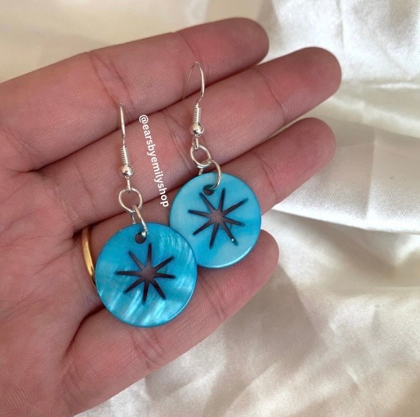 Cool quirky  beach inspired blue sea shell disc earrings with star cut out on silver plated hooks