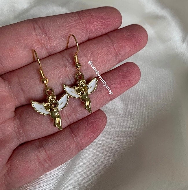 Gold and white angel cupid earrings