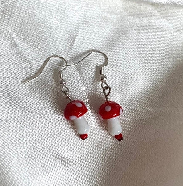 Cool quirky red and white glass lamp work drop dangle earrings on silver plated hooks.