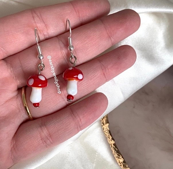 Cool quirky red and white glass lamp work drop dangle earrings on silver plated hooks.